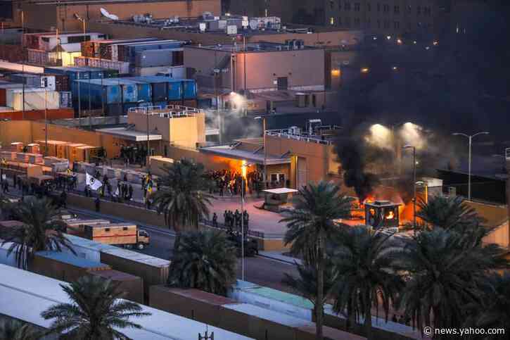 Protesters burn security post at U.S. Embassy in Iraq; Pentagon sending more troops to region