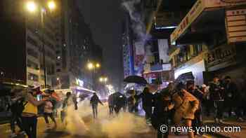 Hong Kong riot police use tear gas to answer firebombs to ring in New Year