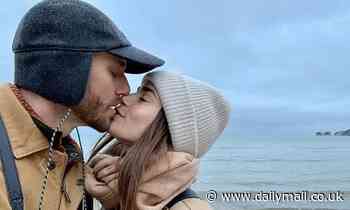 Lily Collins shares a smooch with director boyfriend Charlie McDowell 