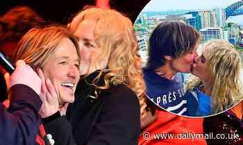 Nicole Kidman kisses her husband Keith Urban onstage in Nashville
