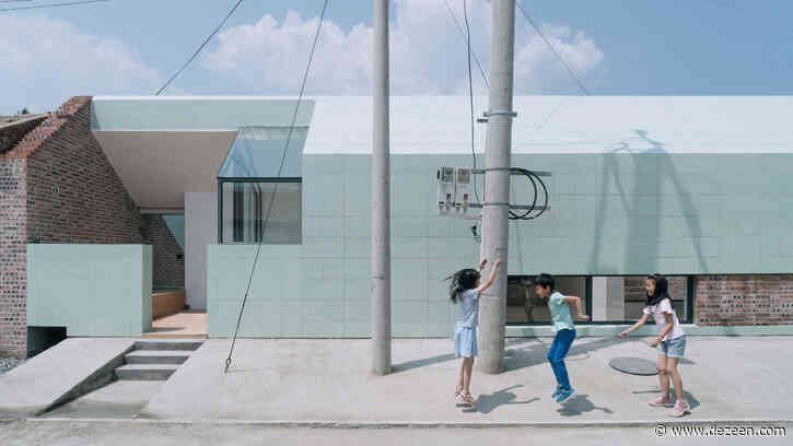 Green ceramic tiles cover extension of a house in rural China