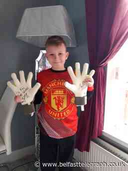Belfast football fan Kai Evitt just g-loves his gift from Man United idol David de Gea