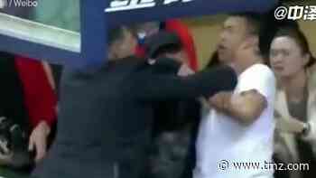 Chinese Basketball Coach Smacks Heckler In Face During Game