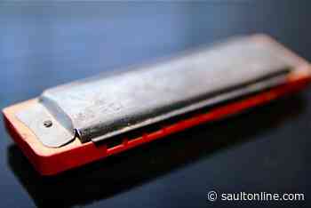 Man allegedly used harmonica to hold up hotel clerk, steal cellphone: police