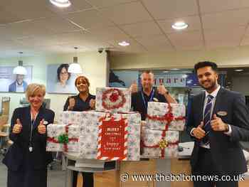 Farnworth and Kearsley Foodbank receives donations from Specsavers