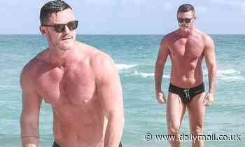 Luke Evans, 40, flaunts his incredible hunky physique in TINY briefs in Miami