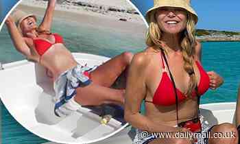 Christie Brinkley, 65, puts her chiseled abs on full display in a red bikini