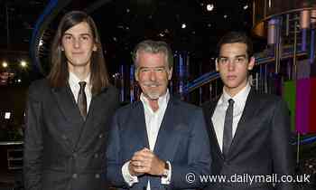 Pierce Brosnan, 66, looks dapper in a blue suit as he poses alongside his sons Dylan and Paris