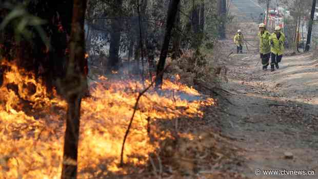 Australian PM calls up reservists as fire threats escalate