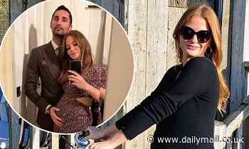 Millie Mackintosh shows off her bump in a black maxi dress as she enjoys a bike ride