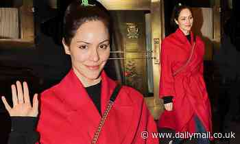 Katharine McPhee dons a striking red coat as she heads off to perform on Broadway in New York