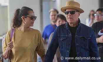 Bruce Willis rocks double denim as he leaves Hawaii with his wife and kids following idyllic holiday