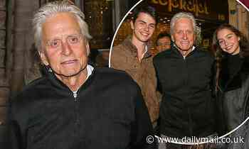 Michael Douglas, 75, avoids the rain at the Grand Bazaar with children Dylan, 19, and Carys, 16