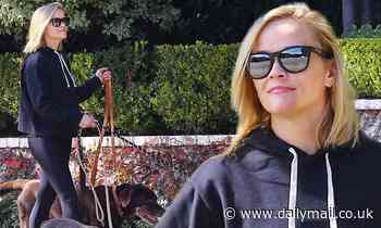 Reese Witherspoon goes from wowing in white to walking the dogs as she braves the Brentwood blaze