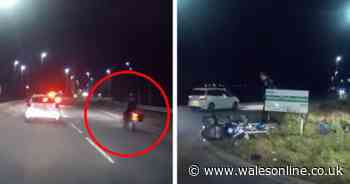 Moment motorcyclist crashes after overtaking cars on wrong side of the road in shocking dash cam footage