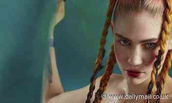 Elon Musk's girlfriend Grimes appears to announce pregnancy with 'knocked up' nude photo