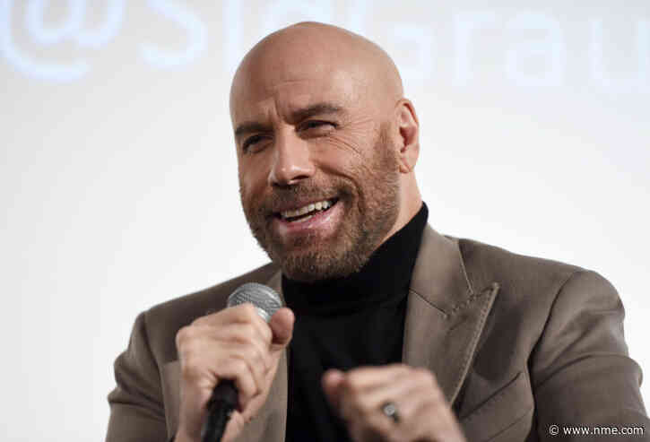 It looks like John Travolta had a lovely time at the Nirvana reunion show