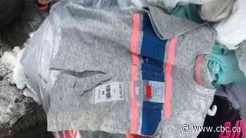 Woman shocked to find new children's clothes cut up in garbage outside Dufferin Mall