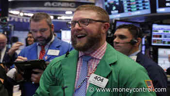 Wall Street hits record high on trade optimism, FAANG rally