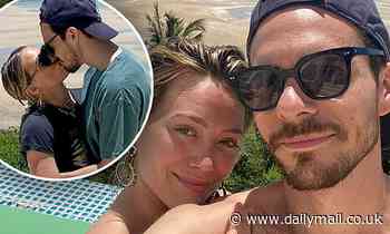 Hilary Duff and new husband Matthew Koma  kiss poolside during their honeymoon in South Africa