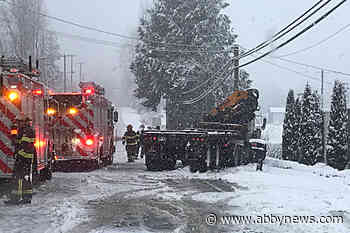 VIDEO: Two people became trapped after crane-truck collides with car
