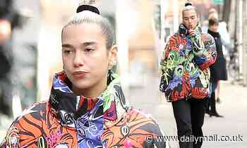 Dua Lipa shows off her quirky fashion credentials in a graphic dragon print coat