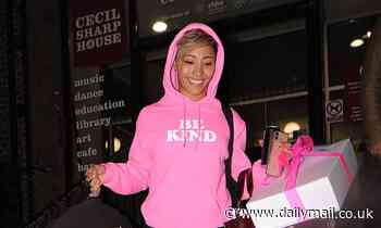 Strictly's Karen Hauer catches the eye in a pink hoodie as she leaves tour rehearsals