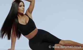 Kim Kardashian flips her long black locks in a style similar to the trademark move made by Cher