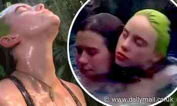 Billie Eilish strips down to her swimsuit for a steamy shower on tropical Hawaiian getaway