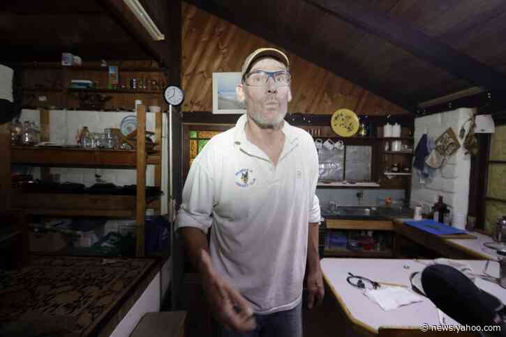 Man burned as huge wildfire forms during Australia crisis