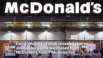 A Utah man unveils a hamburger he purchased from McDonald’s in 1999