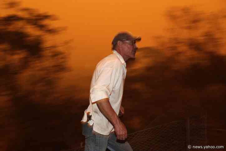 2 Aussie wildfires merge into inferno; man seriously burned