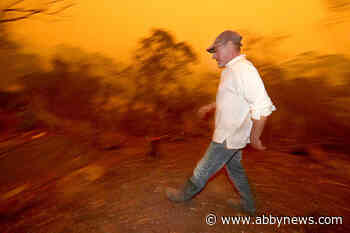 2 Aussie wildfires merge into inferno; man seriously burned