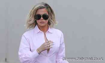 Khloe Kardashian looks like a classic as she steps out in figure-hugging jeans and crisp button-up