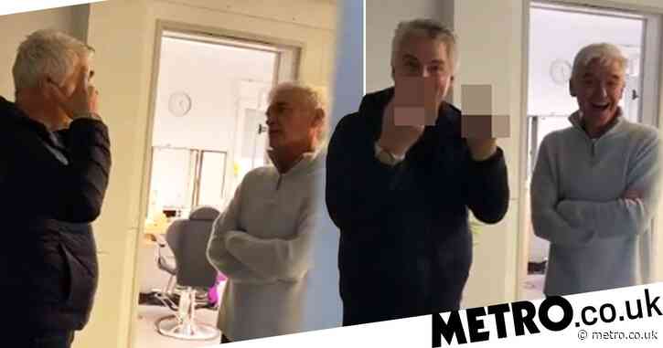 John Barrowman flips Holly Willoughby the bird as she films him bonding with Phillip Schofield over silver hair