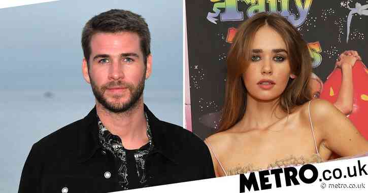 Liam Hemsworth looks smitten with new girlfriend Gabriella Brooks as pair kiss on the beach