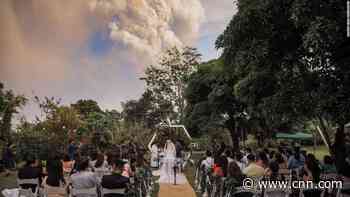 A couple got married while a volcano erupted in the background