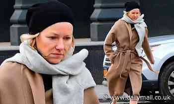 Naomi Watts, 51, is wrinkle free as she bundles up in a robe coat with a sweater worn as a scarf