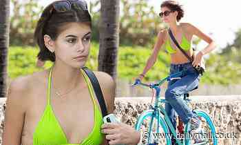 Kaia Gerber wears lime bikini top while biking in Miami with pals