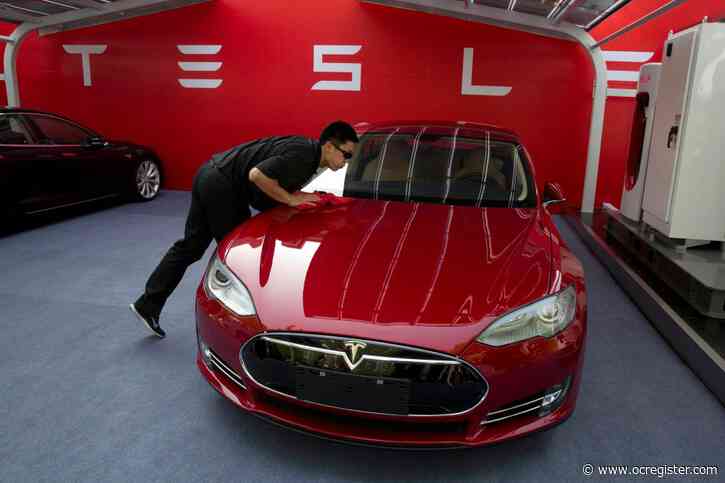 Tesla surges past $500 a share; Musk says cars will soon ‘talk’ to pedestrians
