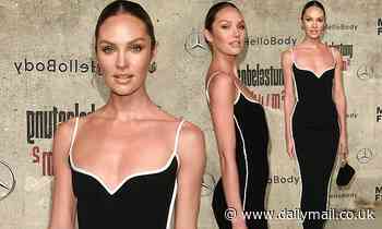 Candice Swanepoel exudes glamour in a figure-hugging little black dress during Berlin Fashion Week
