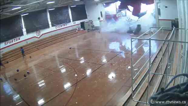 Watch: U.S. students run to safety as 'microburst' tears apart gym roof