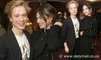 Newly-single Lily James cosies up to fellow actor Freddie Fox as the pair attend Les Miserables show
