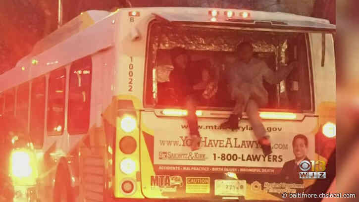Caught On Camera: Two People Catch Ride On Back Of MTA Bus