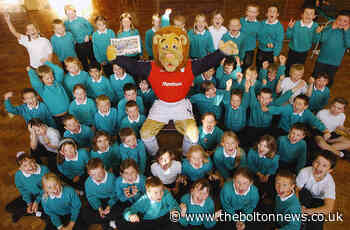 LOOKING BACK: Lofty the lion visits young fans at Eagley Junior School
