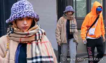 Dua Lipa bundles up in Burberry scarf and leopard print fluffy hat as she steps out with Anwar Hadid