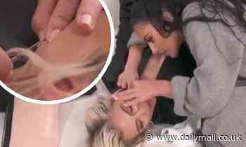 Kim Kardashian diligently pops pimples on sister Khloe Kardashian's face and neck in KUWTK video