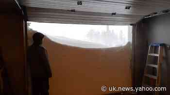 Canadians open garage door on record-breaking snowfall as emergency called