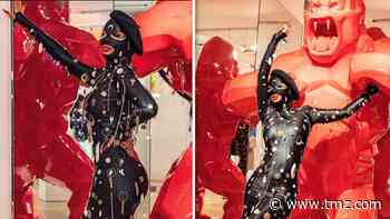 Cardi B Wears Rubbery Black Leather Dress at Paris Fashion Week