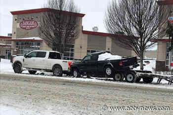 Fraser Valley motorist drives up vehicle ramp and onto parked trailer on Chilliwack road
